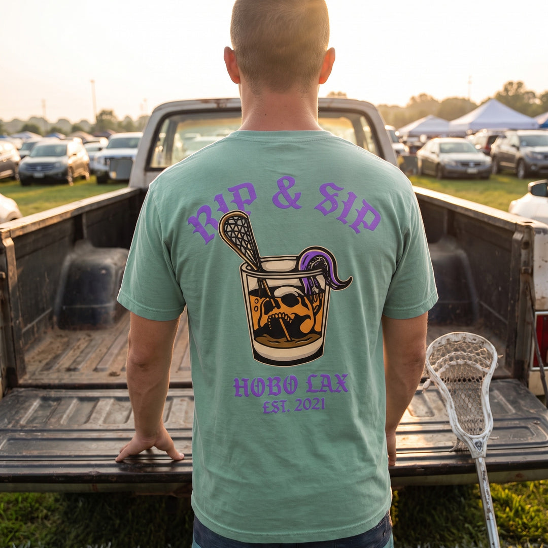 Rip &amp; Sip Tee in seafoam, back print worn at a tournament tailgate by a pickup truck