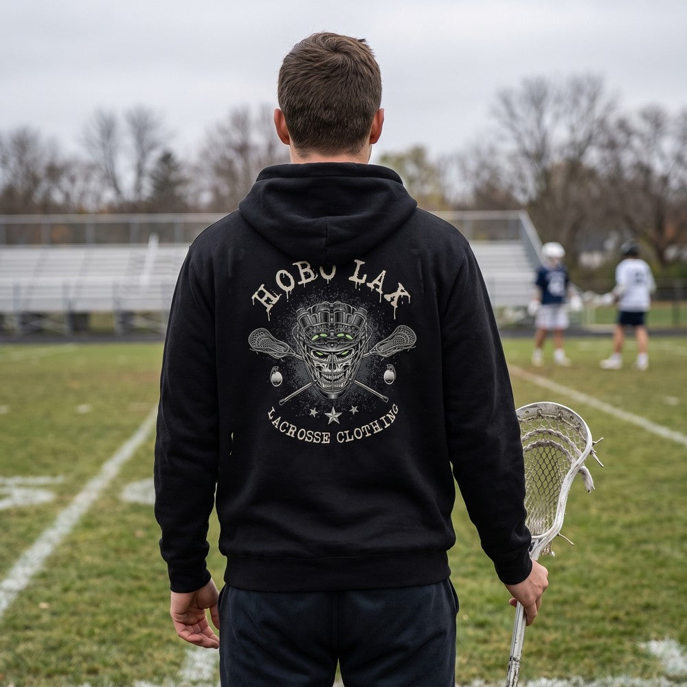 Lacrosse player on the sideline wearing the black Tactical Clear Hoodie, back view