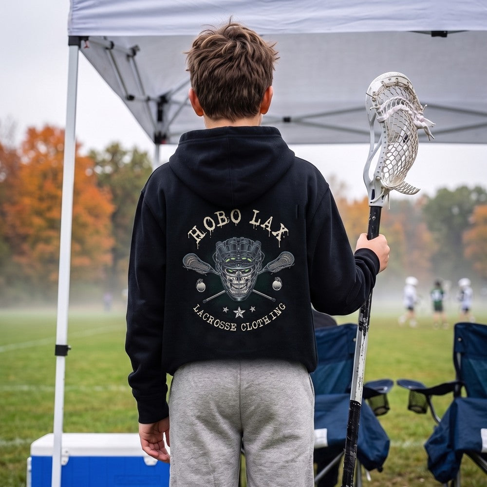 Youth lacrosse player at a fall tournament wearing the black Youth Tactical Clear Hoodie, back view